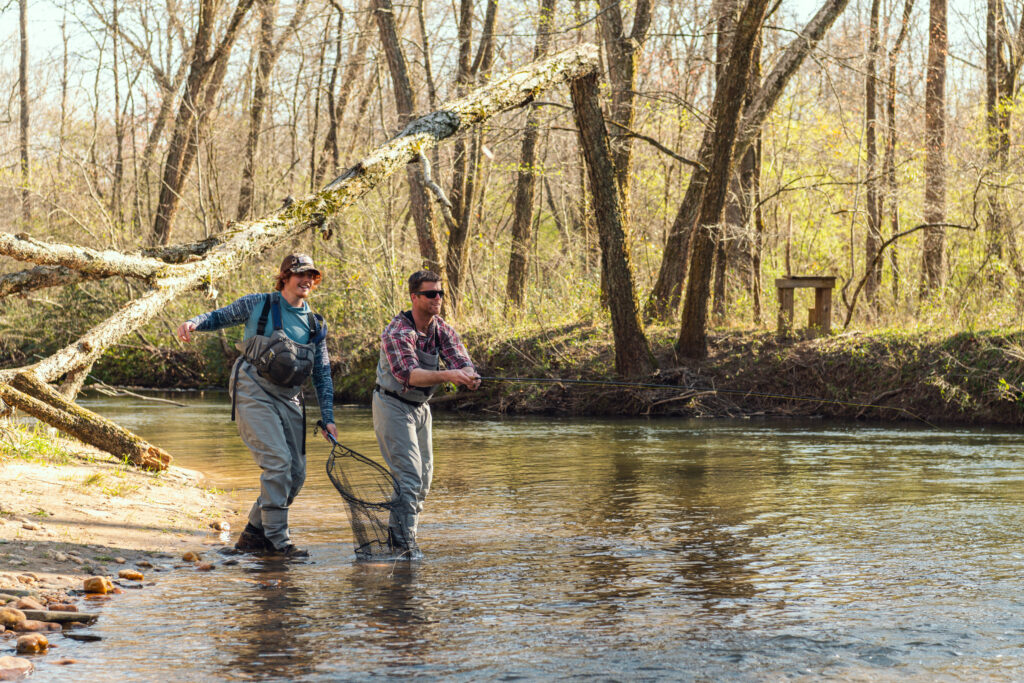 Ryan Peck teaching fly fishing techniques on a guided trout fishing trip